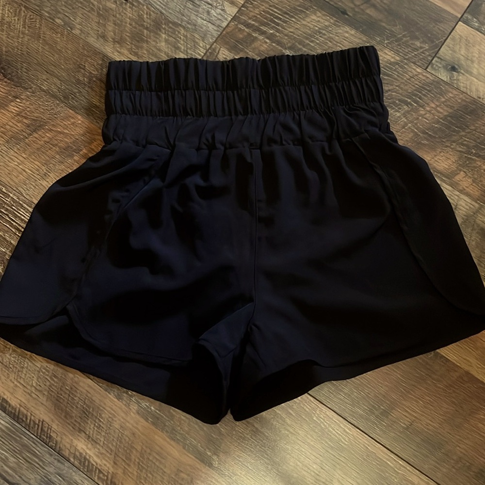 Women’s black high waisted athletic shorts. 1.5” inseam.